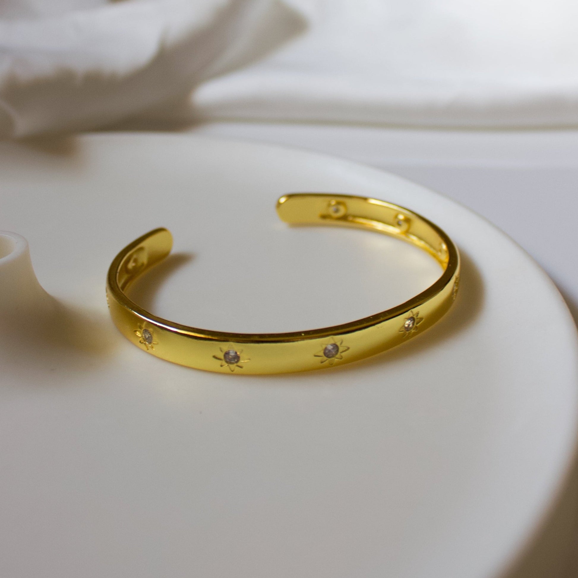 Gold bracelet with embedded stones.